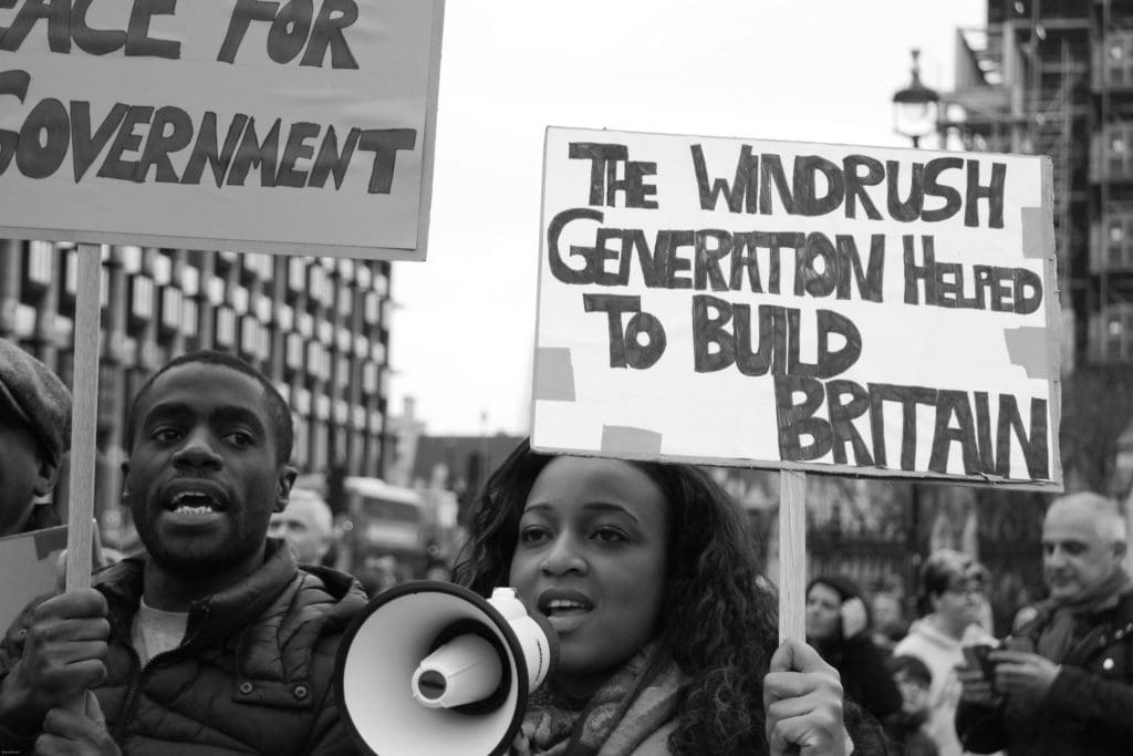 supporters of Windrush scandal victims demonstrating in the street