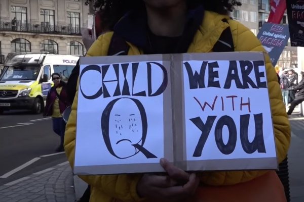 protestor holding a banner supporting Child Q