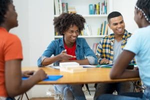 Group of african and south american students in discussion at classroom of university